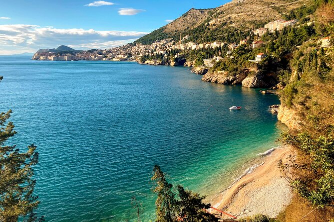 Cavtat to Lokrum Island, Betina Cave & St Jacobs beach boat tour - St. Jakov Beach: cliffside calm with views over the walls
