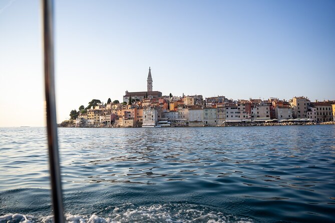 Dolphin Watching Sunset Speedboat Tour with Drinks in Rovinj - Returning through sunset light, plus old town views from offshore