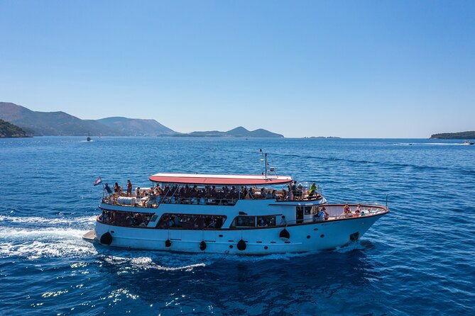 Dubrovnik: Elaphiti Islands Full-Day Cruise with Lunch - Stop 1, Koločep: pine forests, hidden-cave vibes, and swim time
