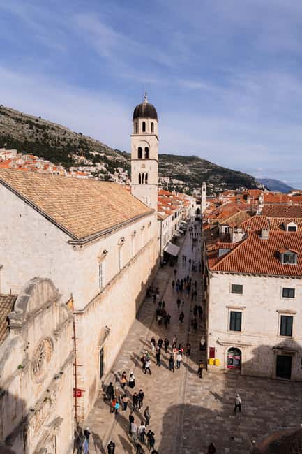Dubrovnik Old Town: Night tour with History, Wine & Bites - Stradun at dusk: the main street becomes a storybook