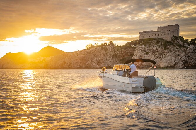 Dubrovnik Sunset Tour By Boat With Local - Dubrovnik Walls: 1,940 meters of defense in golden light