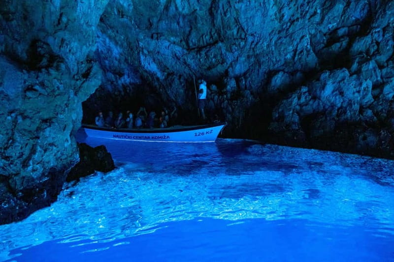 From Milna, Supetar, Postira: Magical Blue Cave and Hvar - Biševo’s Blue Cave: wooden boat entry, sunshine lighting, and the early-sea advantage
