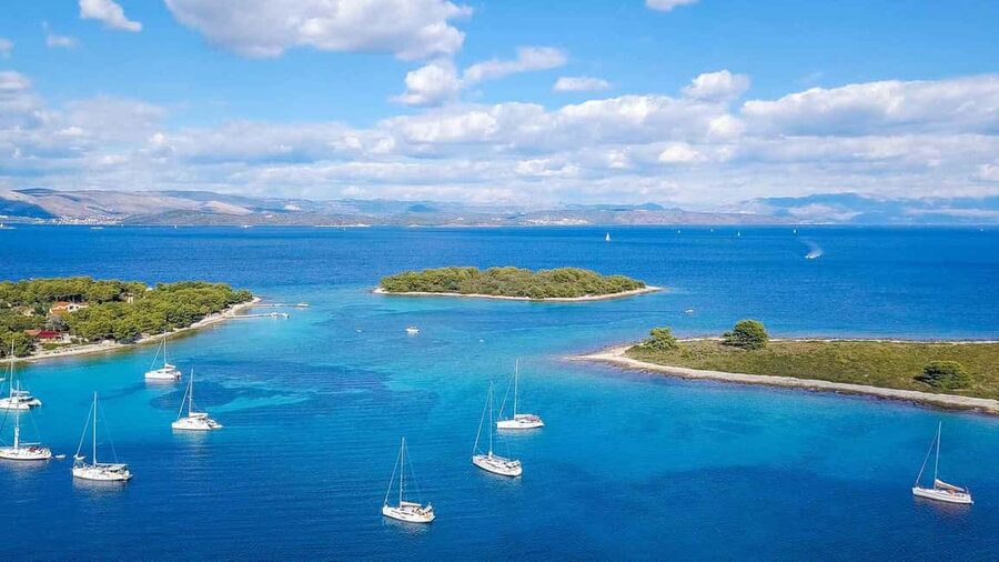 From Split: Blue Lagoon and 3 Island Boat Tour - UNESCO-protected Trogir: coffee, monuments, and an easy promenade stroll