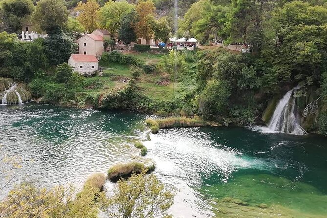 From Split or Trogir: Krka Waterfalls & Primošten Sightseeing - Entering Krka: wooden paths, birdsong, mills, and views