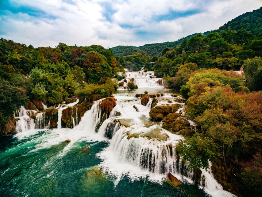 From Split & Trogir: Krka Waterfalls Day Tour with Boat Ride - Inside Krka National Park: trails, the watermill area, and plenty of breathing room