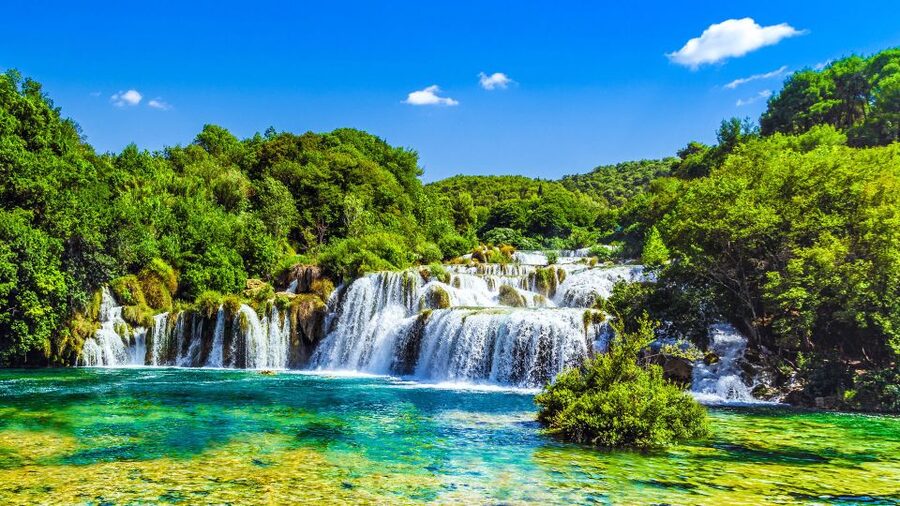 From Split & Trogir: Krka Waterfalls Day Tour with Boat Ride - Guide style and how the day stays organized