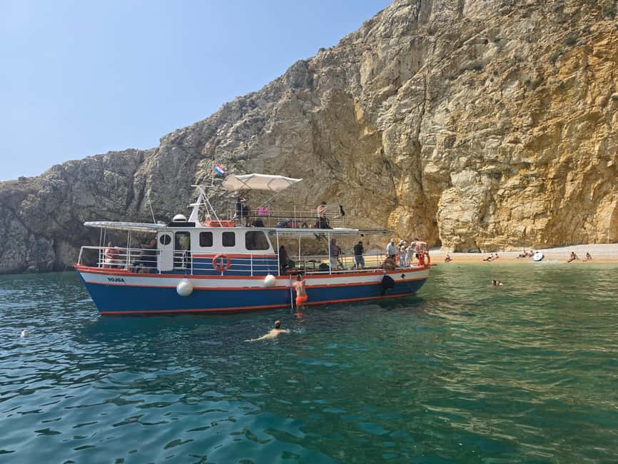 Krk: Golden Beach and Blue Cave Cruise with Welcome Drink - Plavnik Cave swimming: the blue-water effect, without the stress