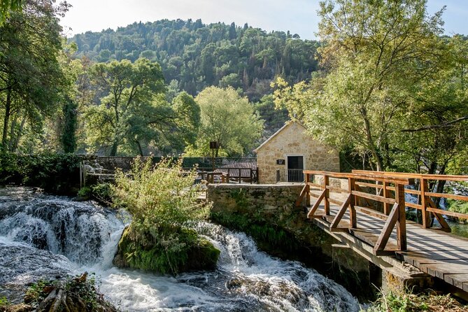 Krka Waterfalls tour with Trogir Walking tour and Krka panoramic boat cruise - Skradinski Buk Walkways: Travertine Falls, Pines, and Easy Footing