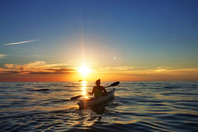 Poreč sunset sea kayaking tour - Harbor water, nearby island time, and a snack break