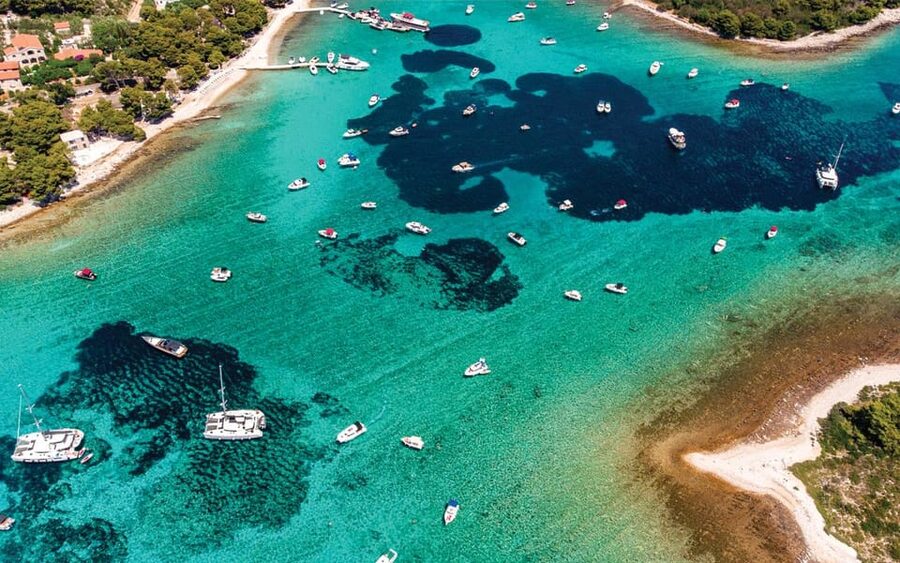 Split: Blue Lagoon and 3 Island Cruise with Food and Drinks - Drvenik Island and the Blue Lagoon jump-in moment