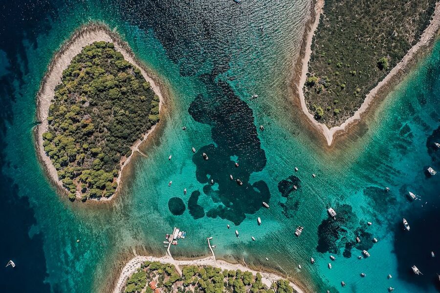 Split: Blue Lagoon and 3 Islands Speedboat Tour - Borkko Beach Bar on Čiovo: pine trees, white sand, and a first swim stop