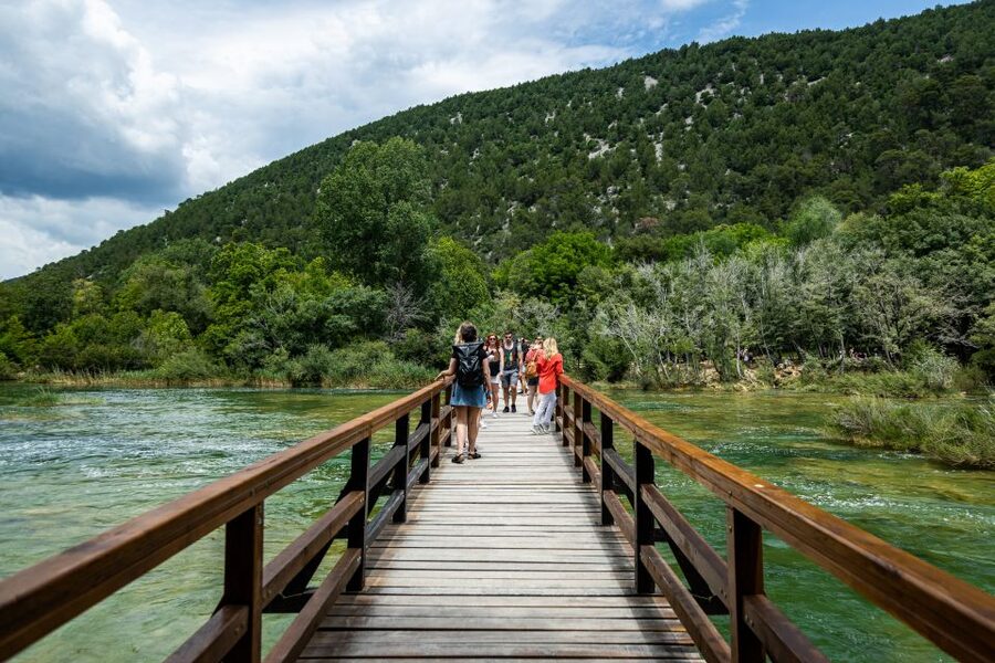 Split: Krka National Park Day Trip with Boat Ride & Swimming - Inside Krka National Park: Waterfalls, Trails, and Culture Stops