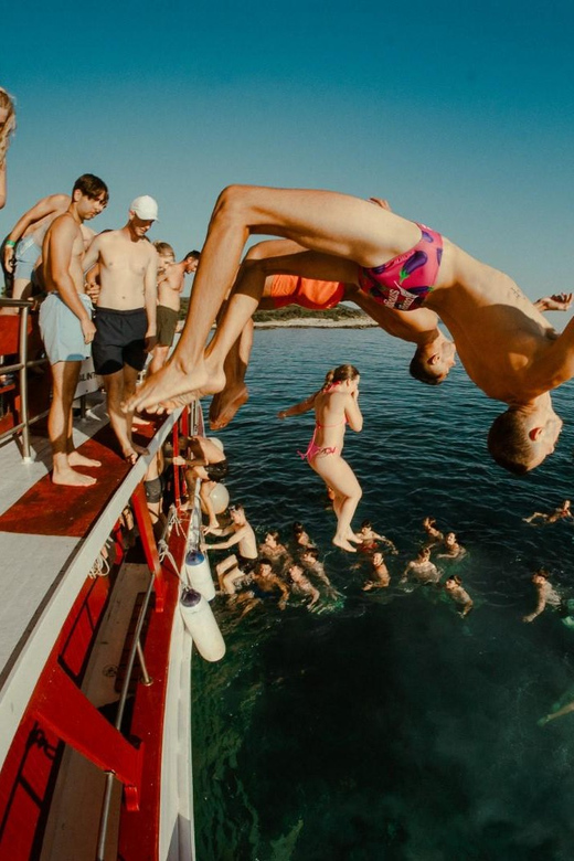 Split: Sunset Boat Party with Live DJs and Blue Lagoon Swim - Sunset return toward Split: dancing with the light change