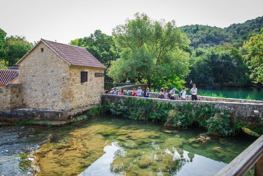 Split/Trogir: Krka National Park Day Trip with Wine Tasting - Skradinski Buk: Waterfalls, Walkways, and Old Watermill History
