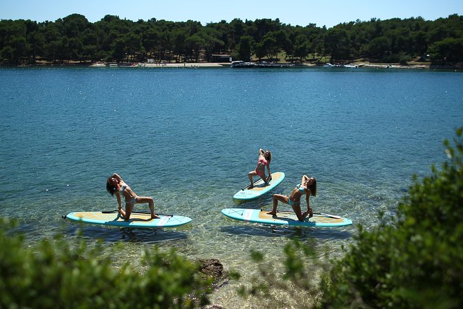 SUP Yoga in Pula: Flow on Water - What “small group coaching” means for your actual body