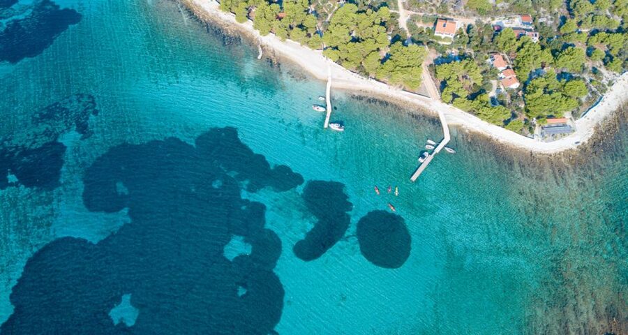 Trogir: Blue Lagoon, Maslinica, and Solinska Bay Boat Tour - Krknjaši Blue Lagoon: longer water time, shallow-color water, and marine spotting