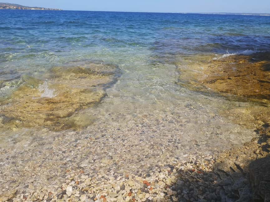 Zadar: 3-Stop Blue Lagoon & Snorkeling Cruise with Drinks - Stop 3: Preko, sandy beach time, and the Galevac monastery option