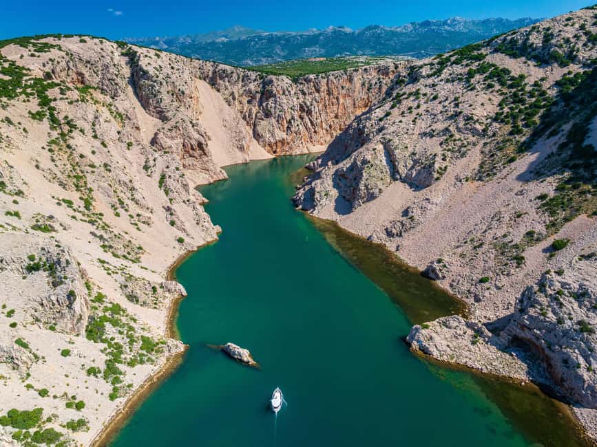 Zrmanja river & 3 Croatian seas boat tour - Novigrad launch, pine trees, and the Fortica backdrop
